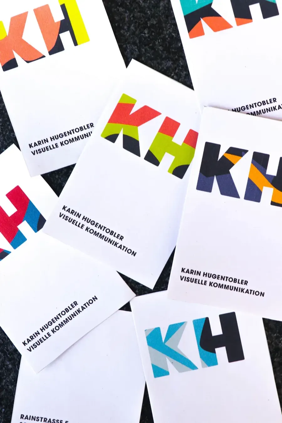 Colorfull business cards of with the corporate identity of the imaginative brand «KH».