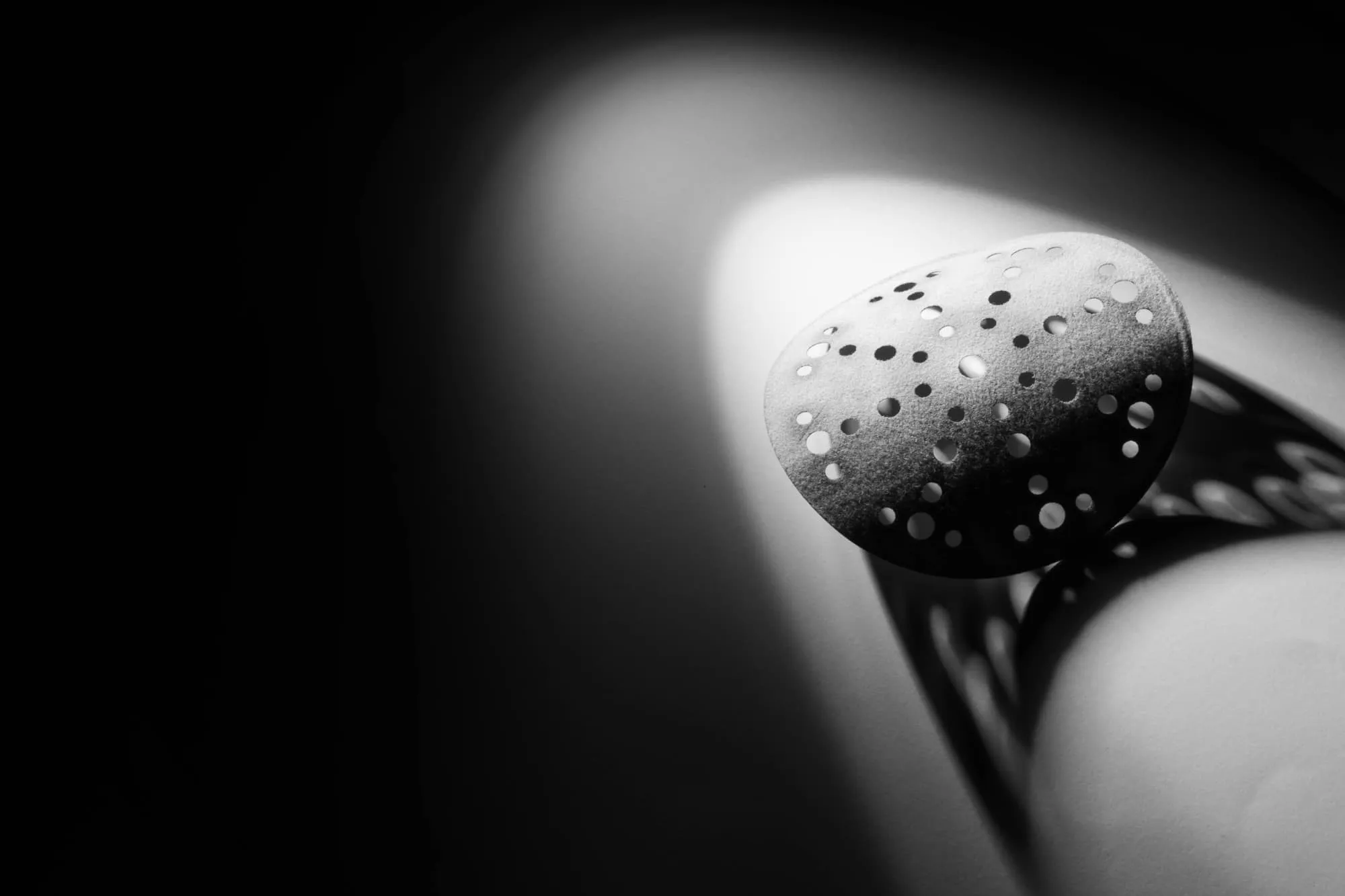 Black and white photography of sandpaper and safety glasses.