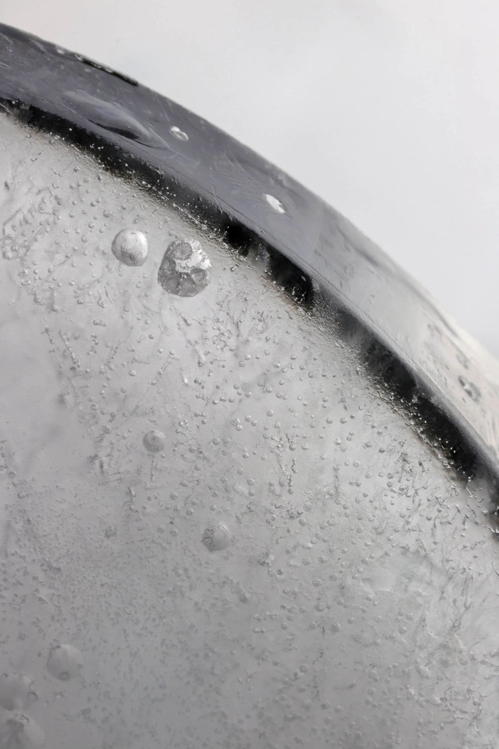 Black and white photography of ice showing the texture of it.