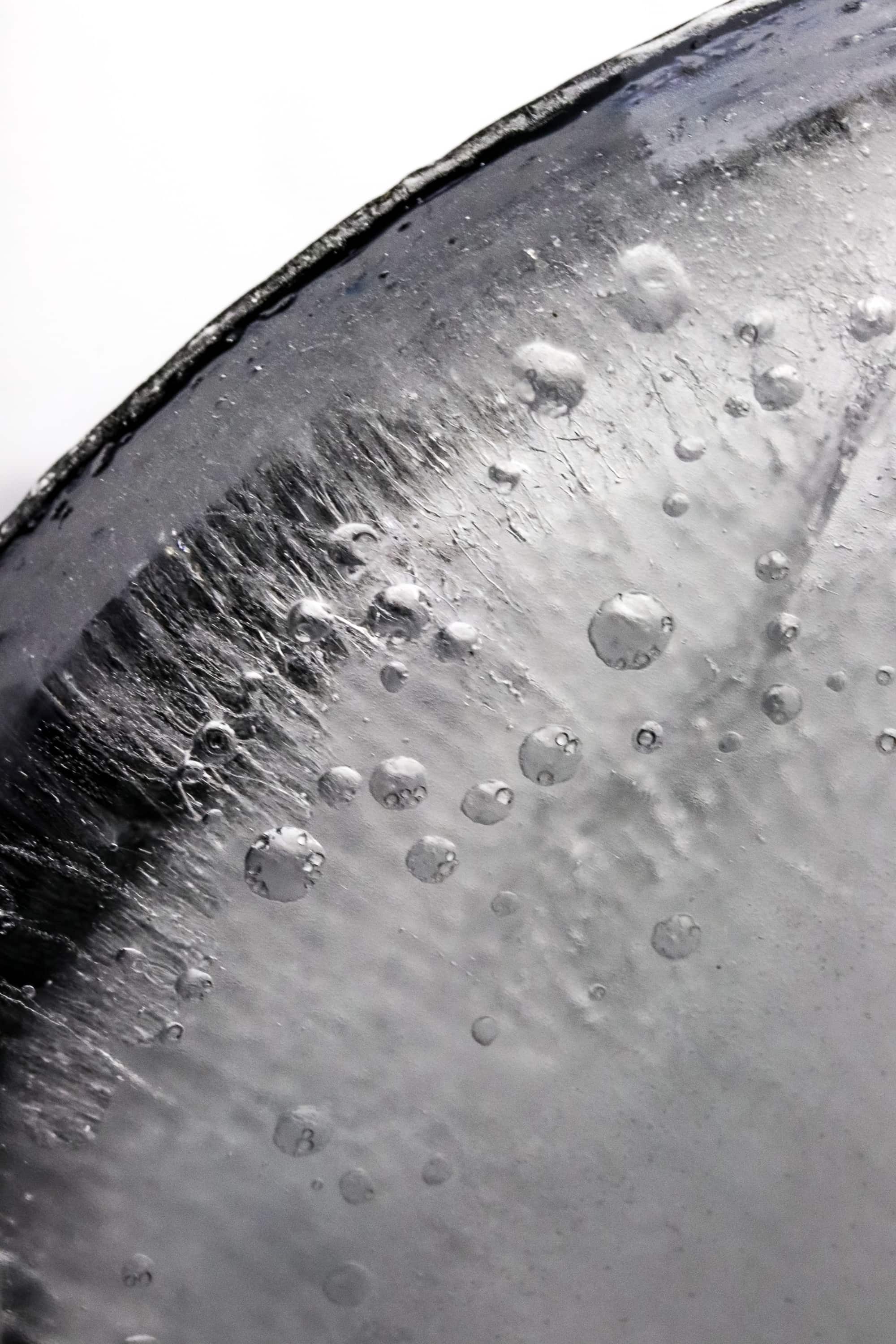 Black and white photography of ice showing the texture of it.